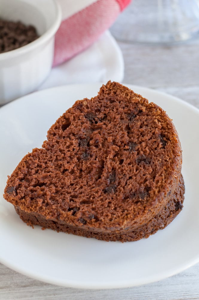 a piece of chocolate sour cream bundt cake on a plate