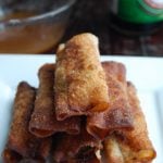 Stacked lumpia on plate.