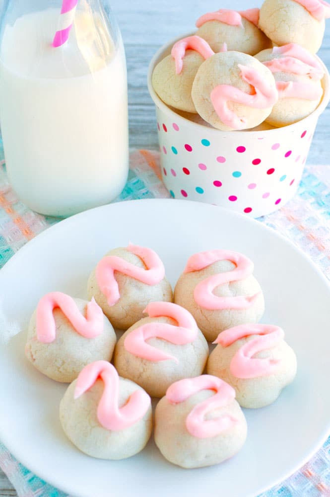 Cherry bon bon cookies on a plate with milk