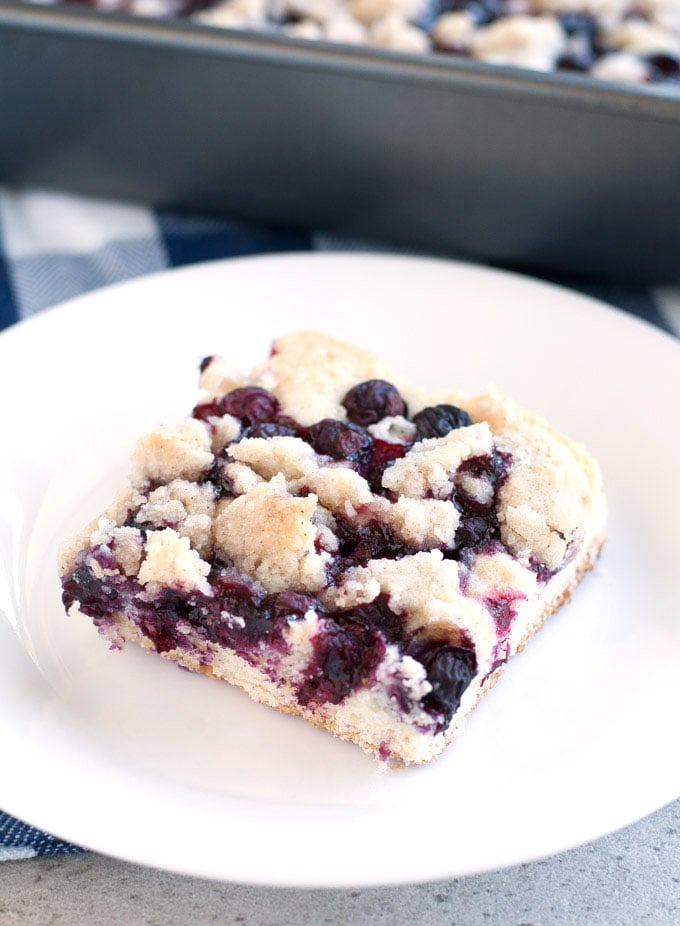 Slice of blueberry buckle on a plate