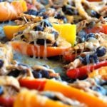 Peppers filled with black beans, chicken and cheese.