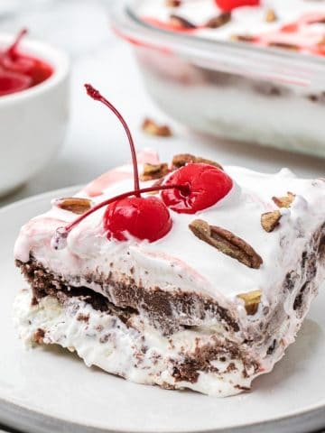 Piece of layered pudding dessert on plate.