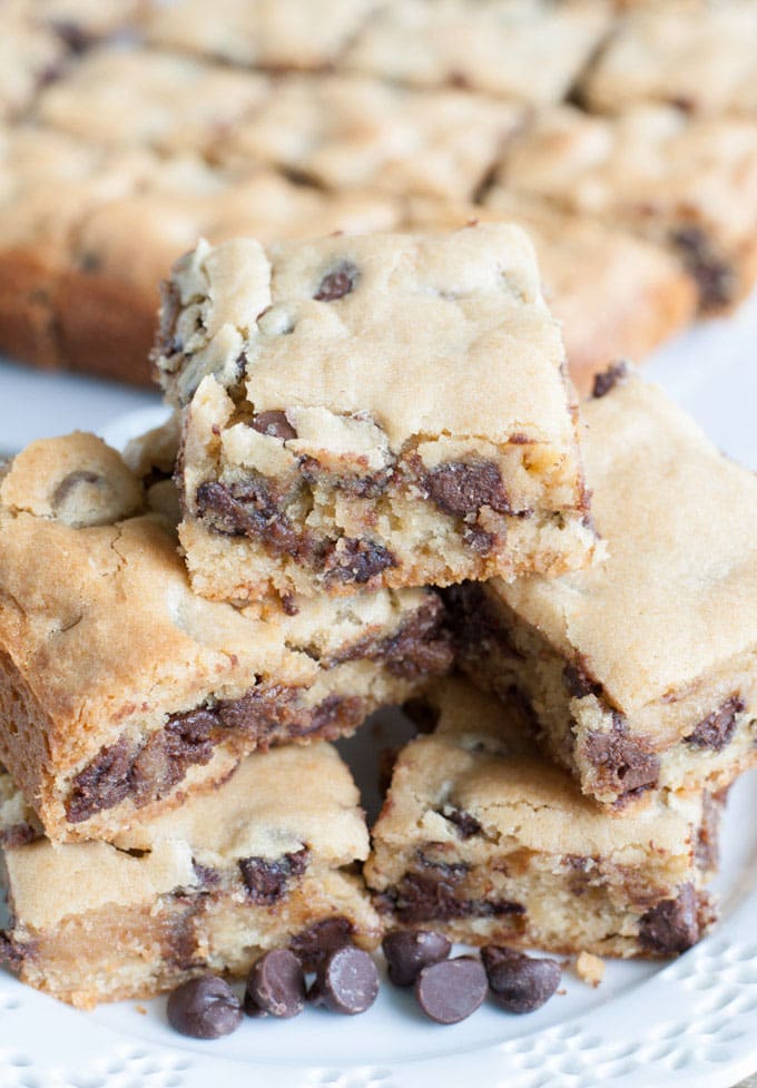 Chocolate chip bars cut into squares on a plate. 