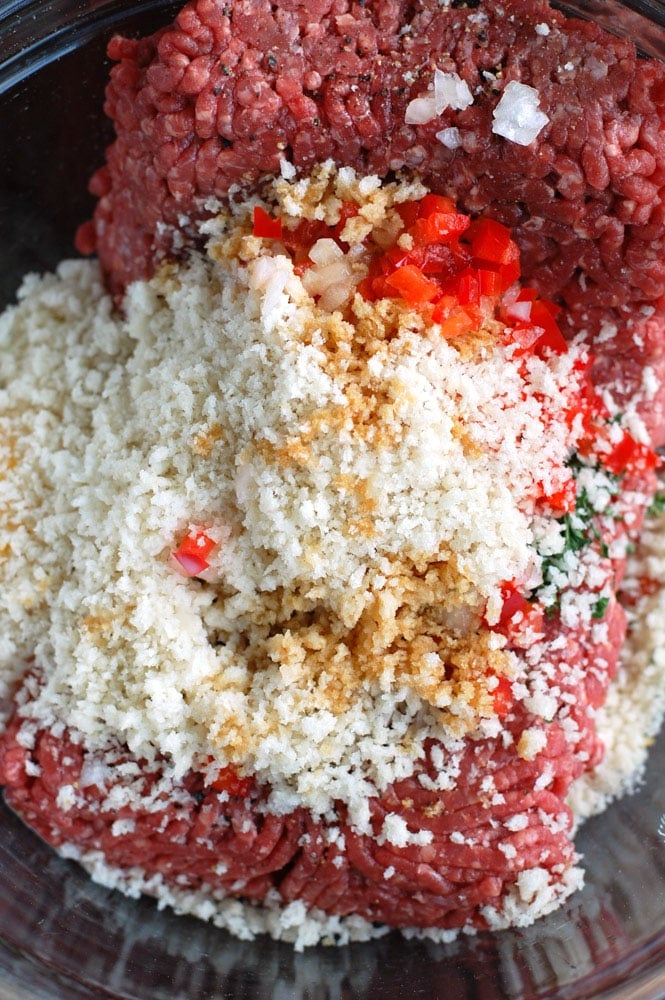 Ingredients for meatloaf meatballs in a bowl ready to be mixed