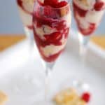 Champagne glass with ice cream and raspberries.