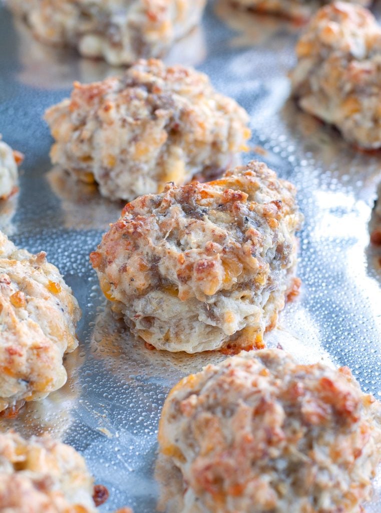 sausage balls baked on a cookie sheet pan