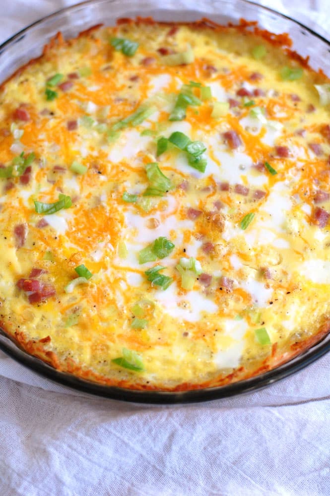 hash brown crust breakfast casserole. Filled with ham, cheese, eggs and a hash brown crust. 