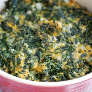 Spinach with cheese in casserole dish.
