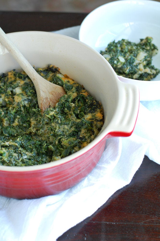spinach casserole in a red dish