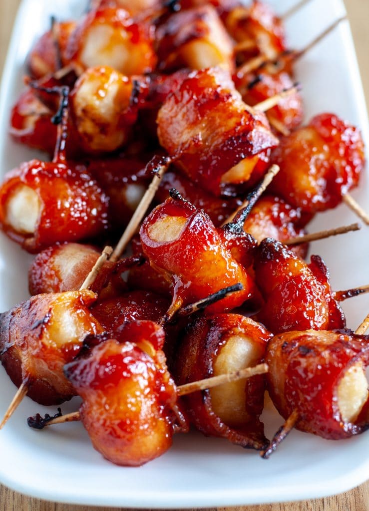 bacon wrapped water chestnuts on a plate