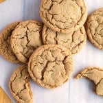 Stack of ginger cookies on board.