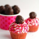 Cupcake with red and pink sprinkles.