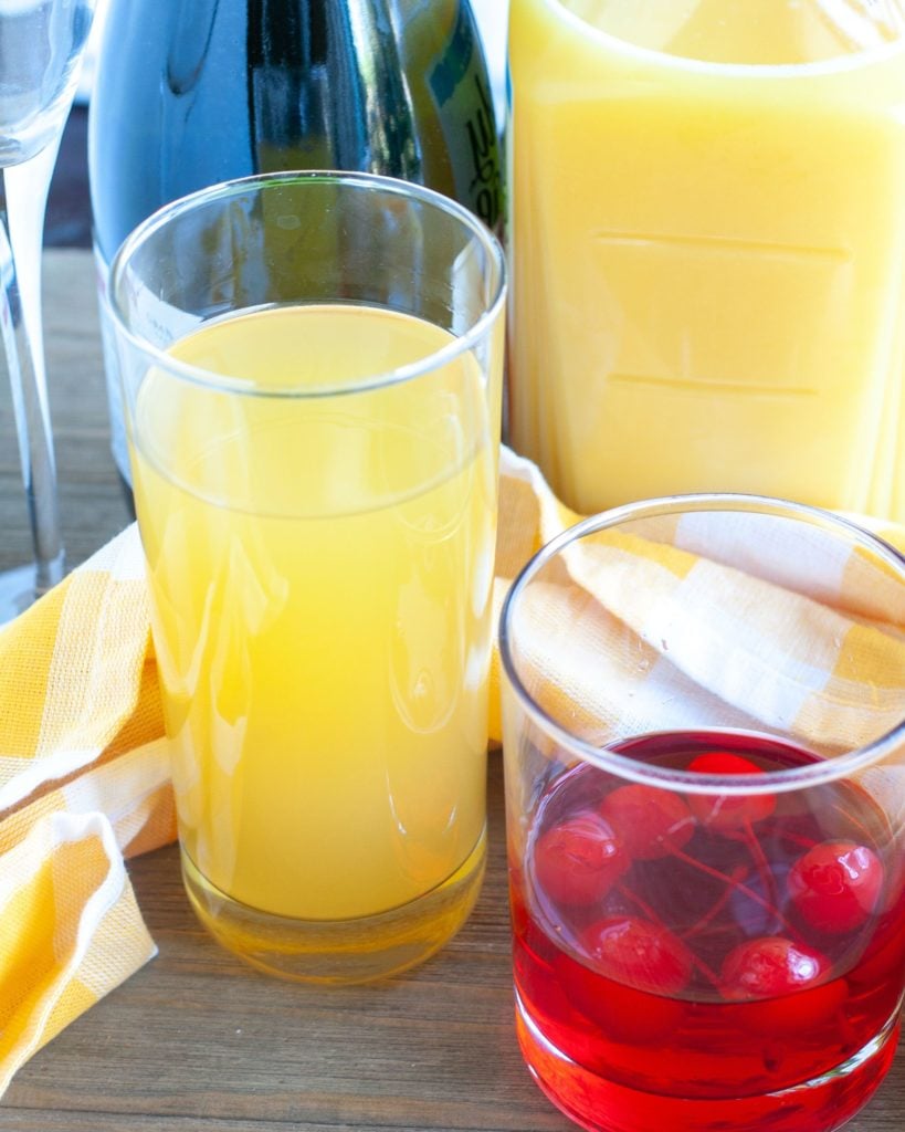 Pineapple juice, orange juice, cherries and sparkling wine
