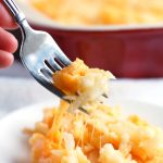 Hash brown Casserole with fork on plate.