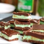 Creme De Menthe Bars stacked on plate.