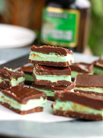 Creme De Menthe Bars stacked on plate.