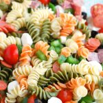 Bowl of tri-colored pasta salad.