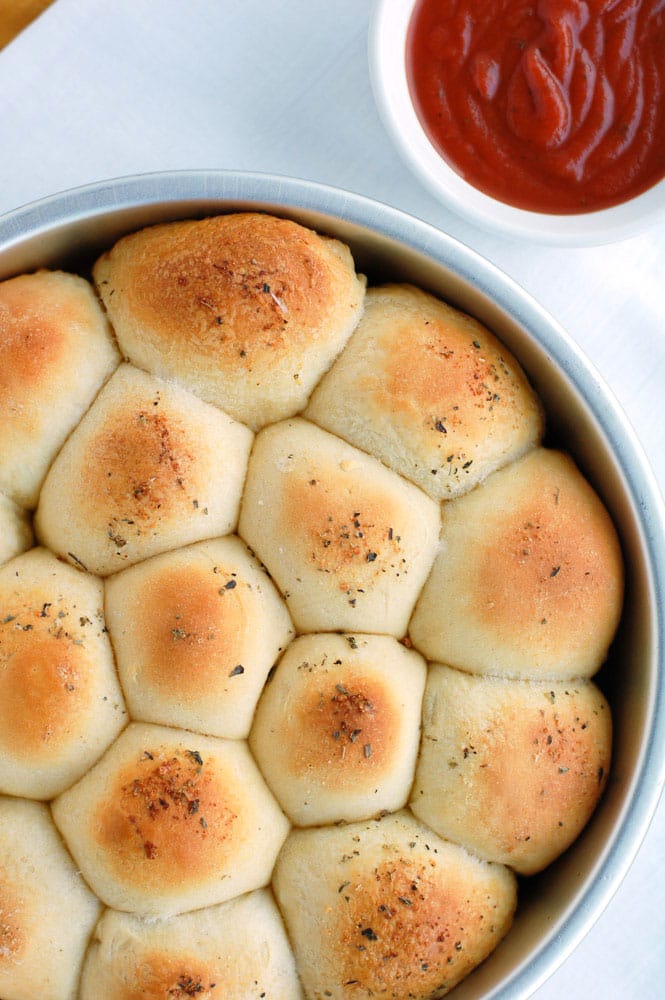 Meatball biscuit bombs make the perfect meal or snack. Cheese and meatballs rolled up in a biscuit, they are like little meatball subs.