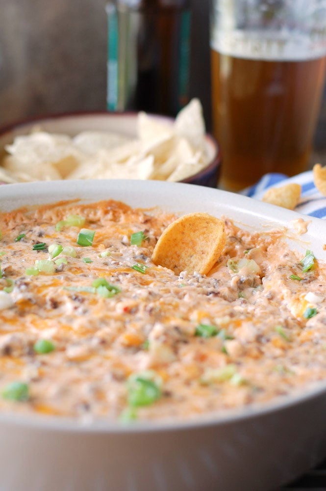Hot Sausage Beer Cheese Dip with a chip 