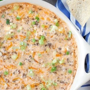 Baking dish with cheese dip and tortilla chips