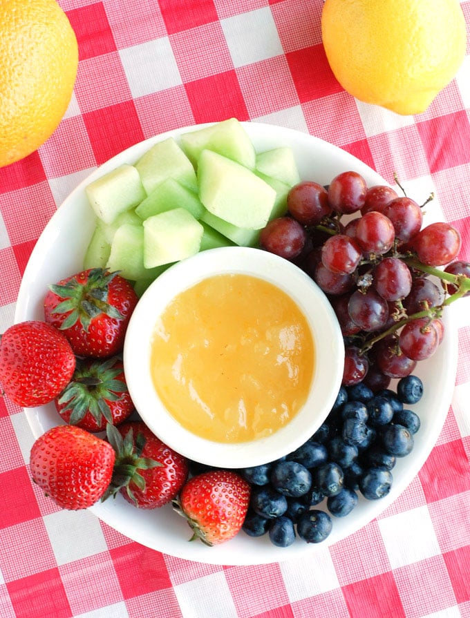 A refreshing orange dip that is perfect for dipping your summer fruit.