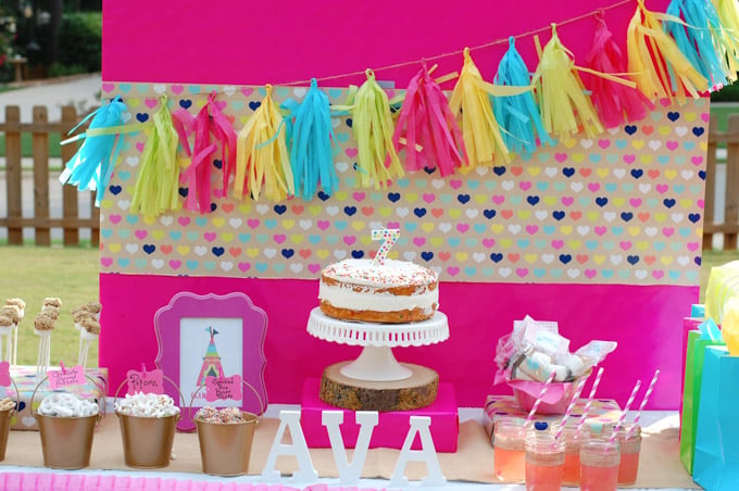 This Glamping party has everything you need including printables, smores pops and tissue paper tassel tutorial.