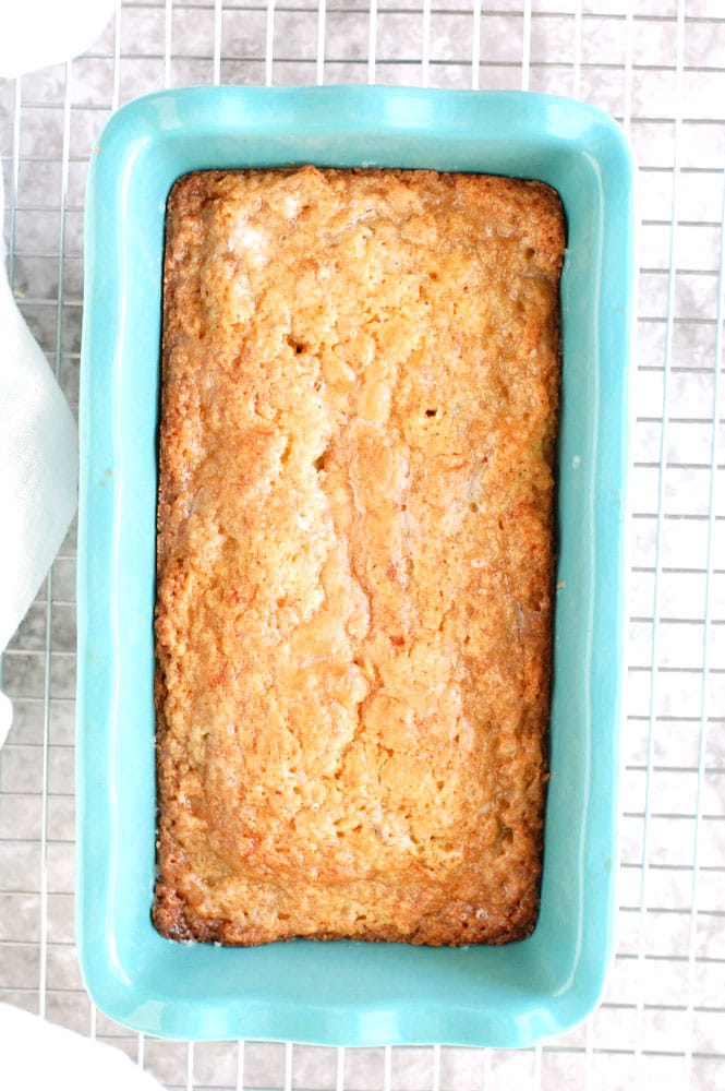 Zucchini Bread in a blue baking dish on a wire rack