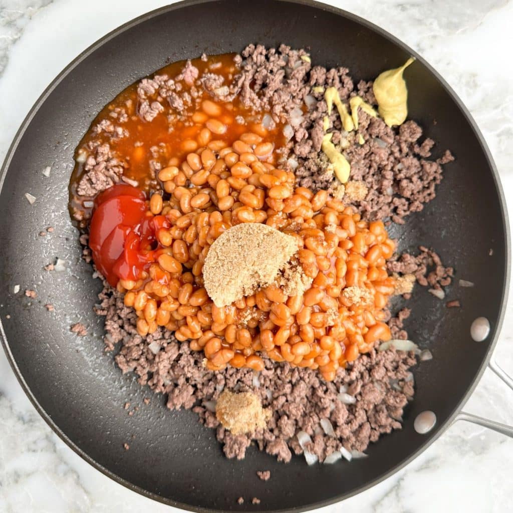 Skillet with ground beef, beans, brown sugar, ketuchp. 