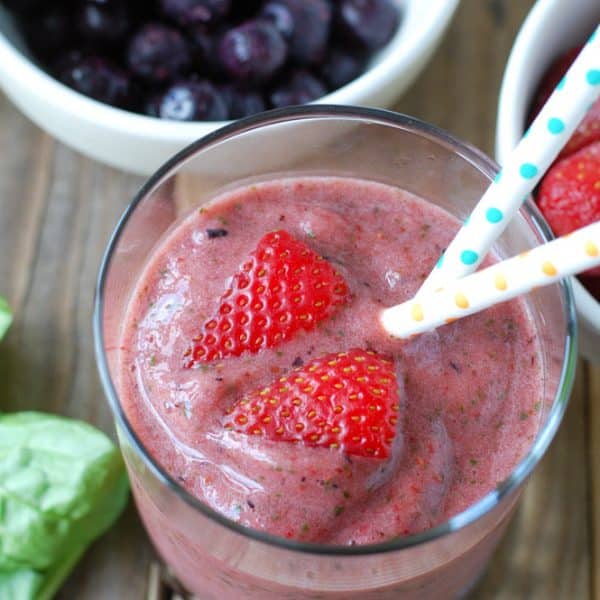 Glass of smoothie with strawberries.