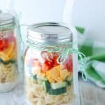 Jar filled with pasta salad.