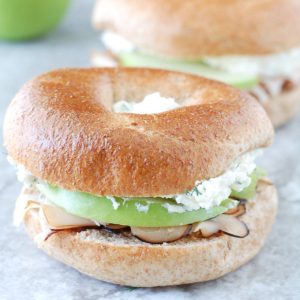 Bagel sandwich with apple and turkey.
