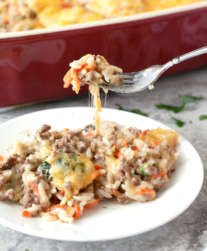Rice and ground beef casserole on plate with fork. 