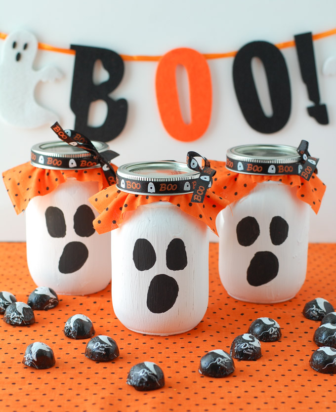 3 ghost mason jars with candy
