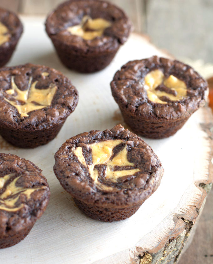 Delicious little brownie bites with a hint of pumpkin cheesecake swirl. Pumpkin cheesecake brownie bites are a great sweet treat to make for any party.