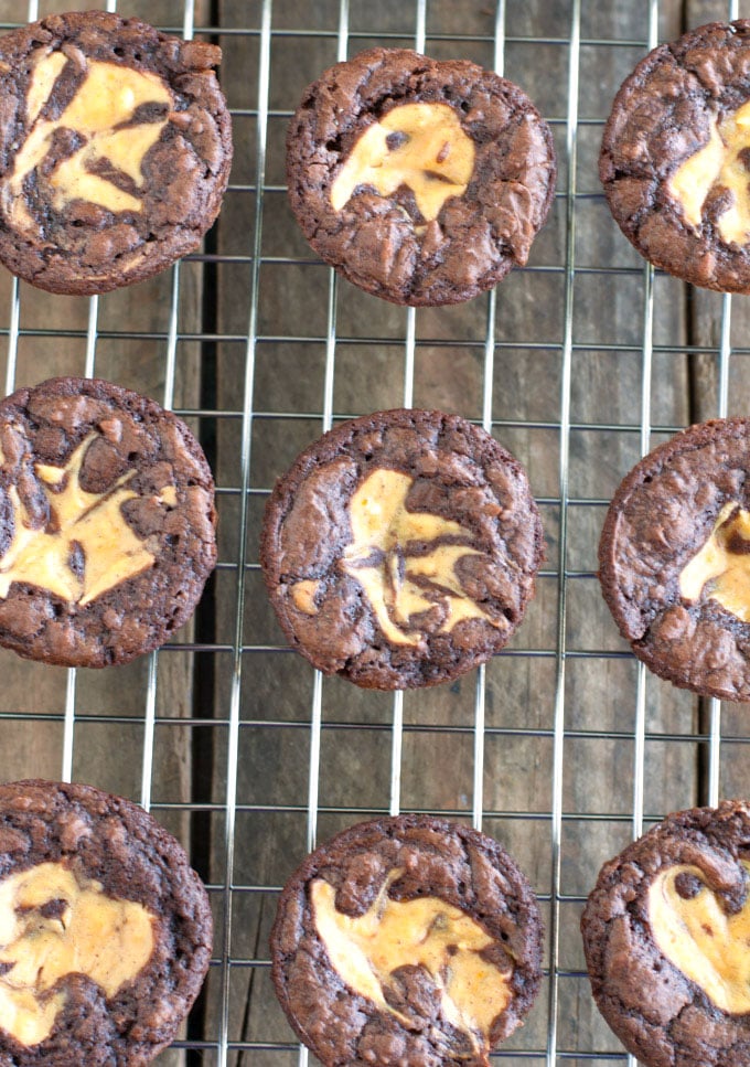 Delicious little brownie bites with a hint of pumpkin cheesecake swirl. Pumpkin cheesecake brownie bites are a great sweet treat to make for any party.