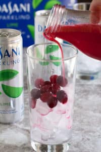 sparkling cranberry mocktail Welcome the holidays with this sparkling cranberry lime mocktail. Full of bubbles and a hint of lime and cranberry, this mocktail is sure to please your holiday guests.