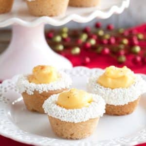 Three cookie cups on a plate.