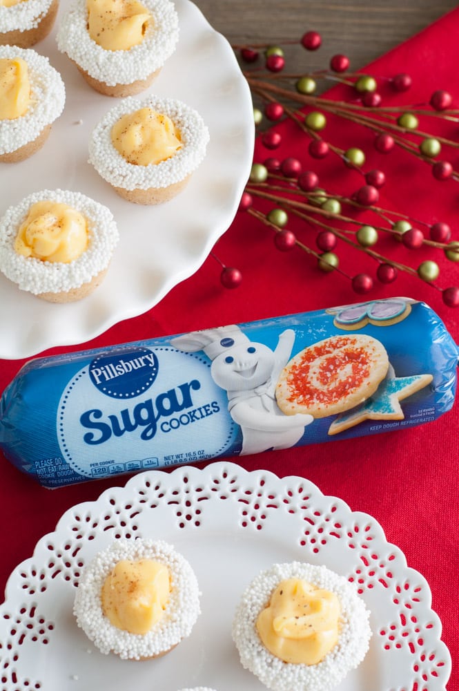 Package of cookie dough and cookie cups on a plate