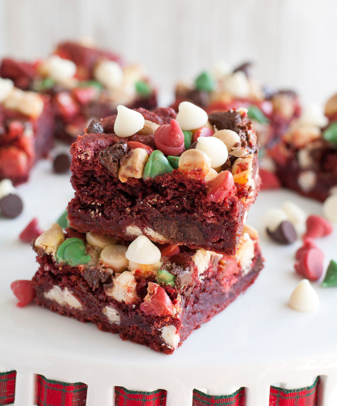 Stacked red velvet cookie bars with chocolate chips. 