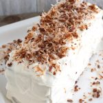 Cake with topped with toasted coconut.