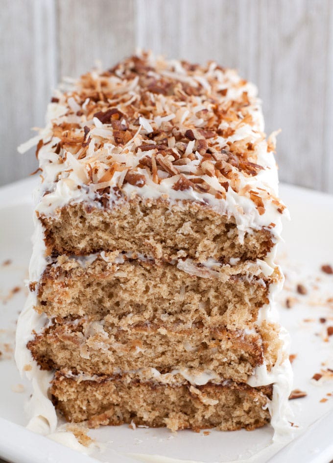 Layered coconut spice cake with cream cheese frosting is a cake sure to impress your guests. Filled with warm spices, coconut and chopped pecans, this cake has texture and amazing flavors.