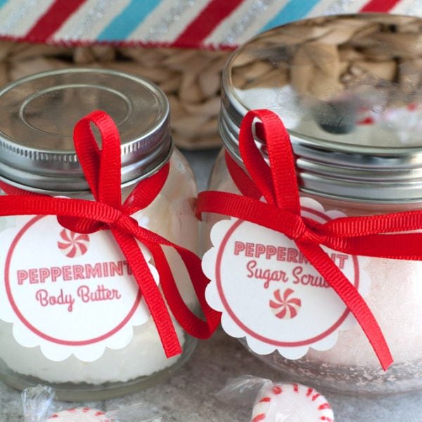 Jars of sugar scrub and body butter with red ribbon.