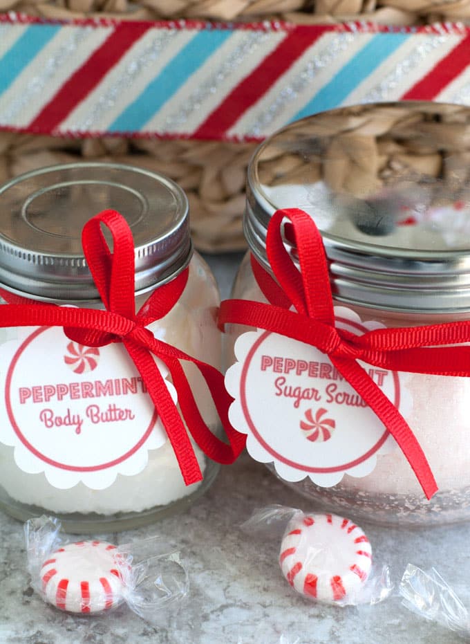 Jars of sugar scrub and body butter with red ribbon. 