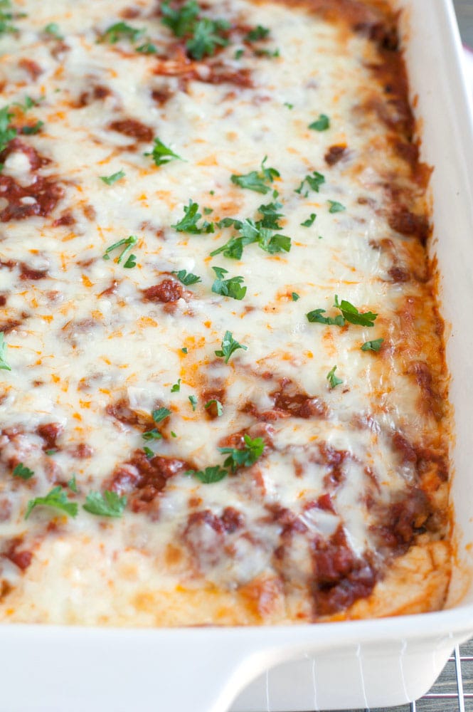 Baked Ravioli Lasagna in a white casserole dish