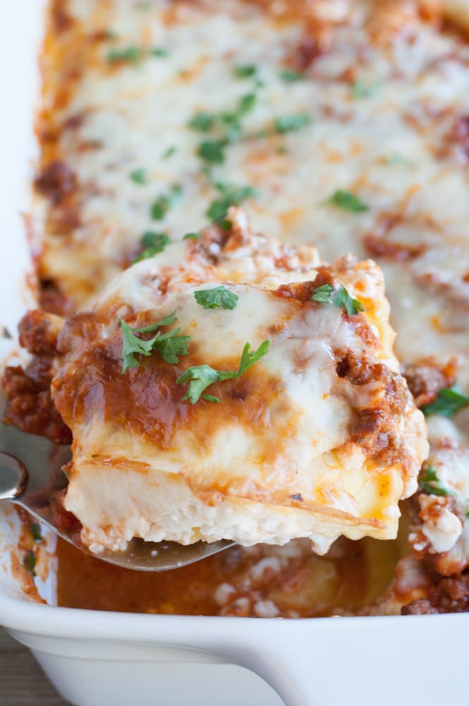 Spatula holding a piece of pasta casserole. 