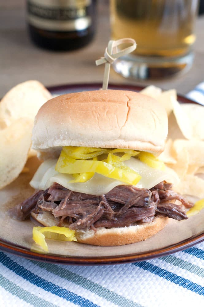 Shredded beef sandwich with cheese and peppers. 