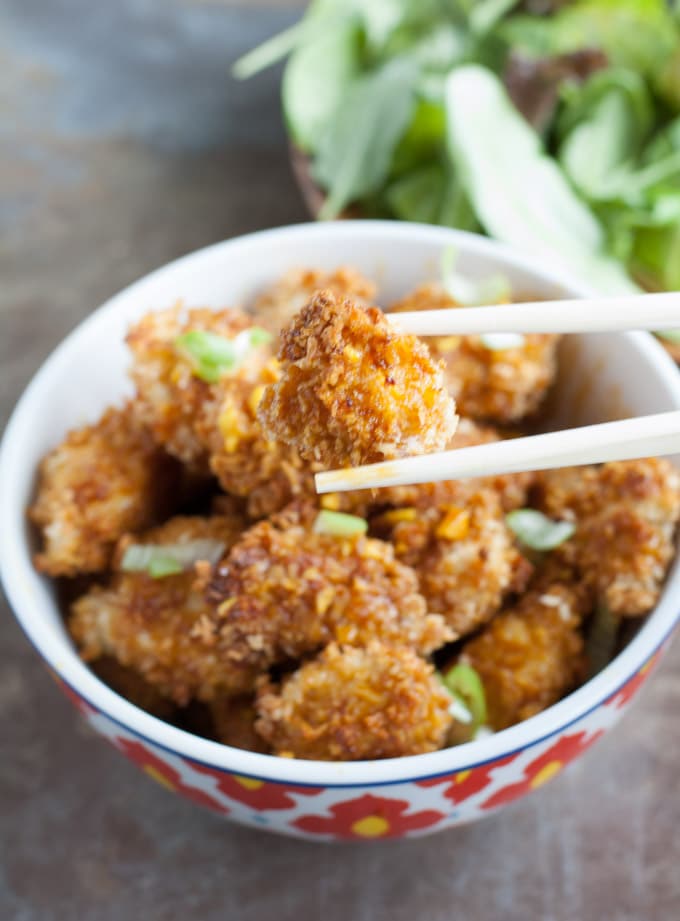 turmeric chicken nugget in chopsticks