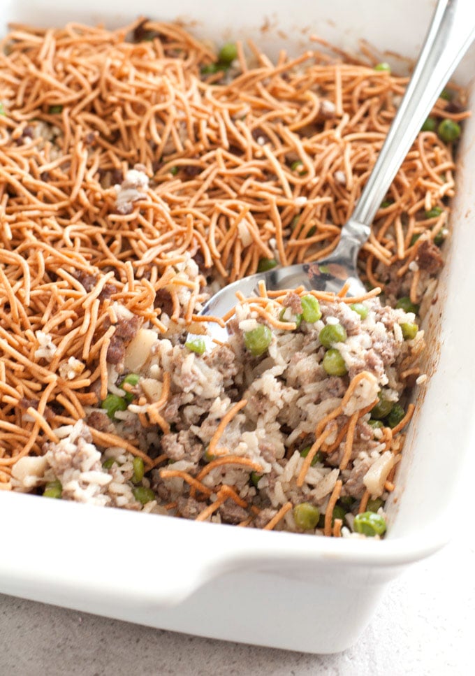 Asian Beef and Rice Casserole with crispy chow mein noodles and serving spoon