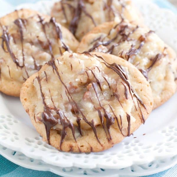 Chocolate chip cookies with frosting on a plate.