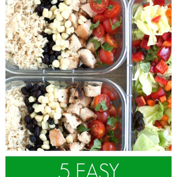 Container with strawberries, salad and chicken, rice and corn.